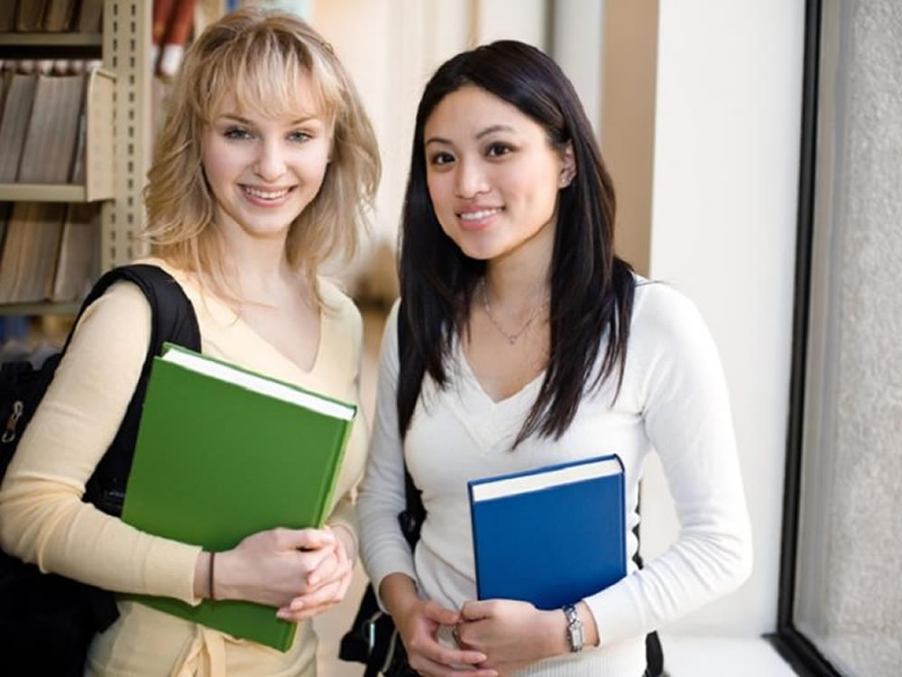 Two female college students, interested in saving for college