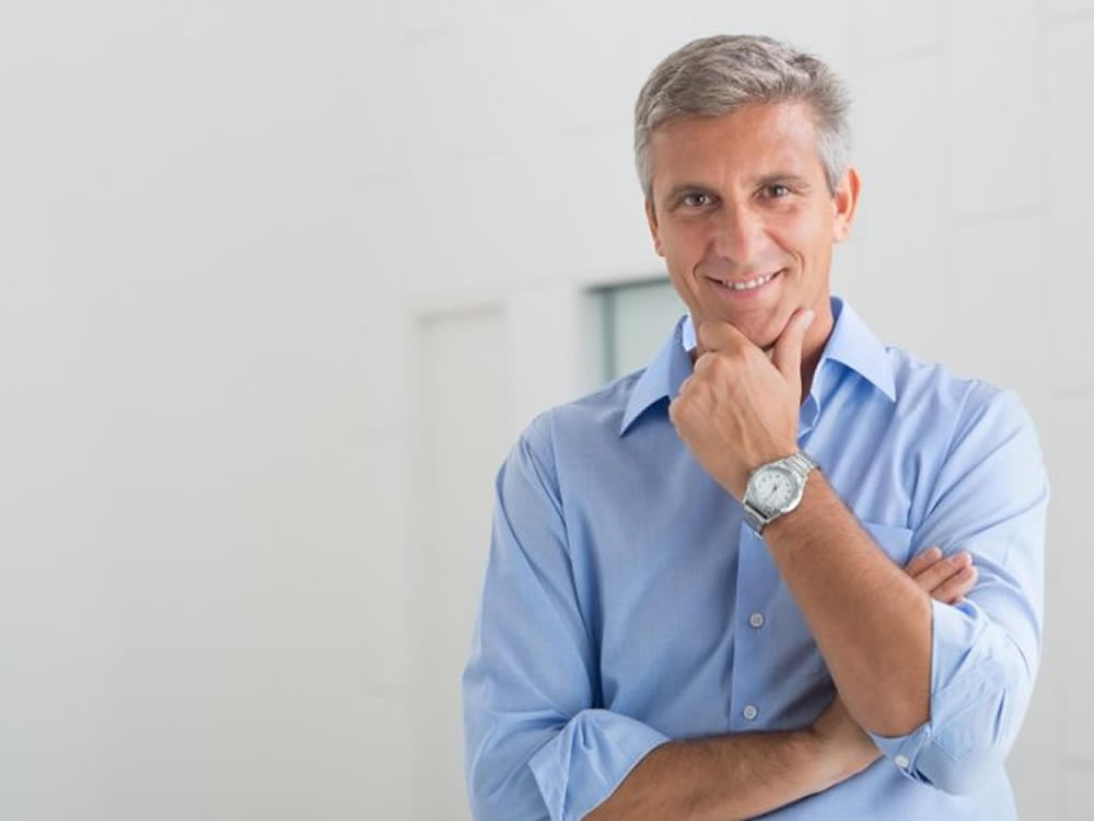 Middle-aged business man considers New Year resolutions for business and career success