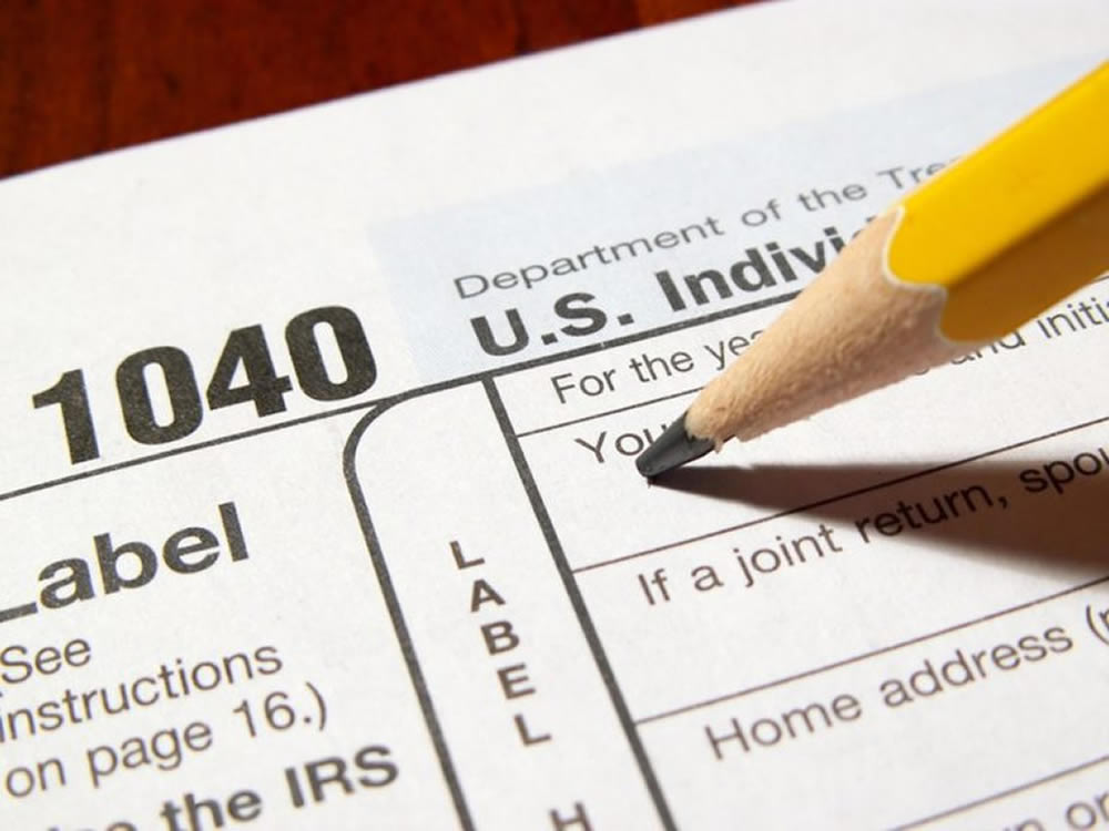 Pencil on 1040 form at the start of a new year and new tax year