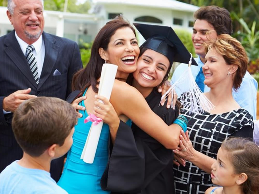 Teen girl celebrates with financial graduation gifts