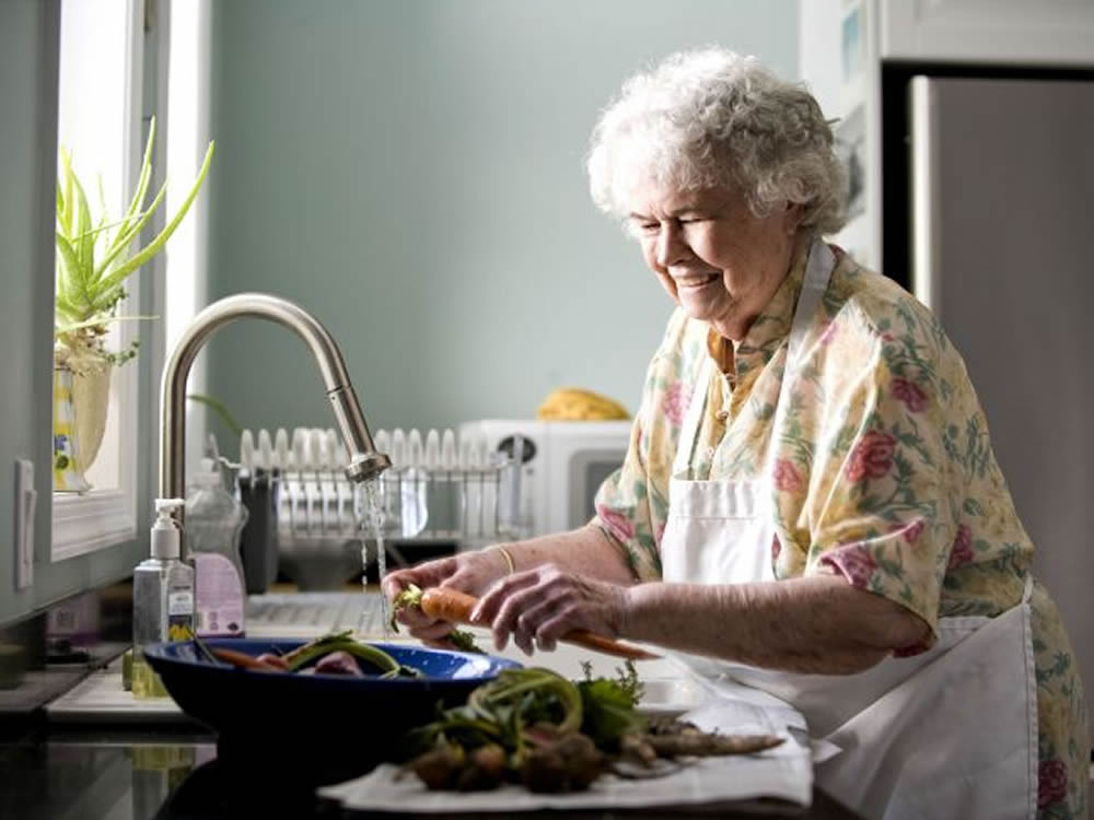 Old lady living independently thanks to sensible housing choices in retirement