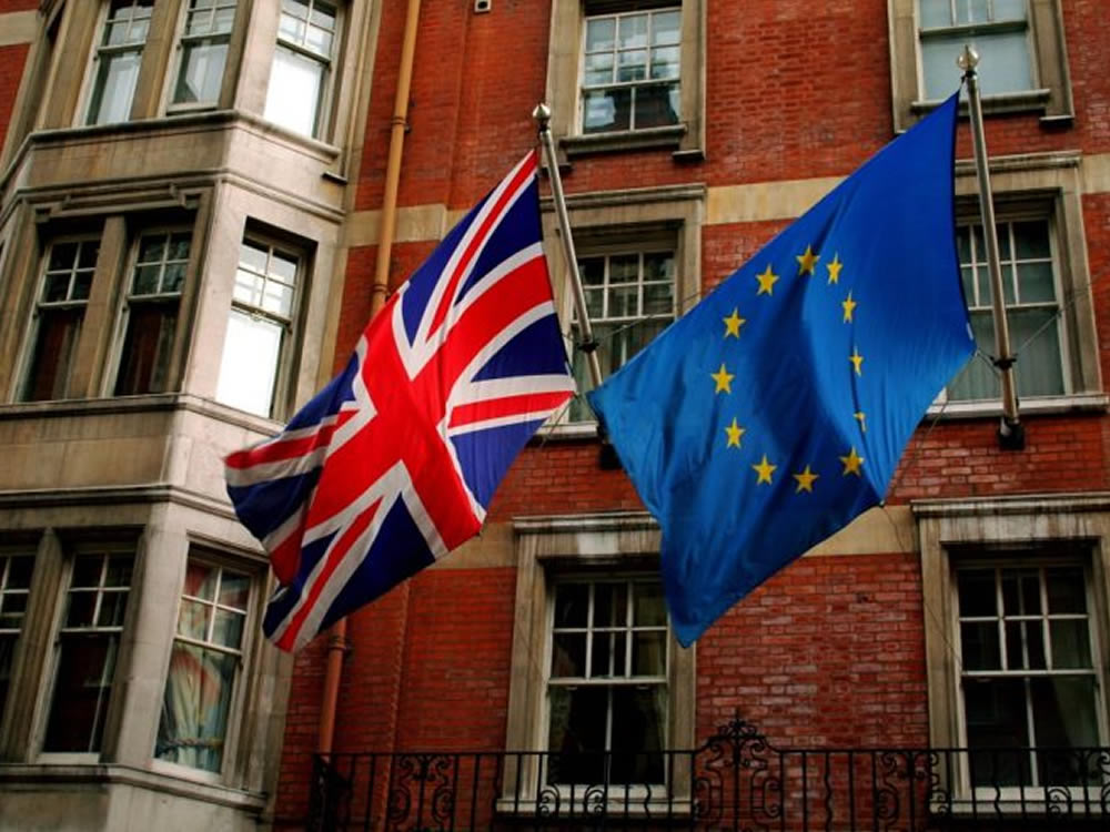 UK and EU flags flying side by side following Brexit vote