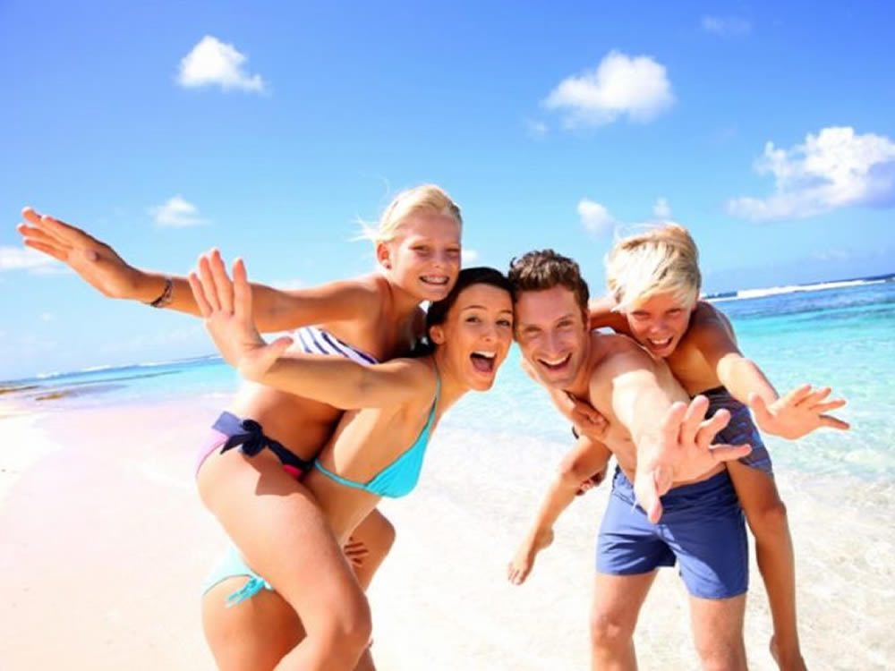 This fun family on sunny beach used travel apps to get there