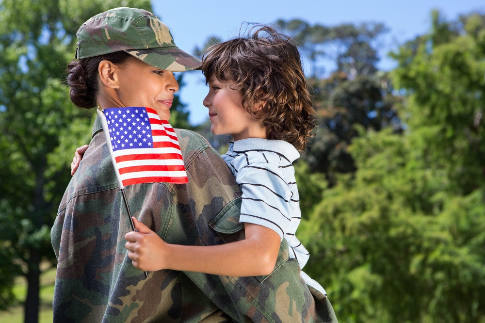 Military mom and son with flag deserve salute to our heroes